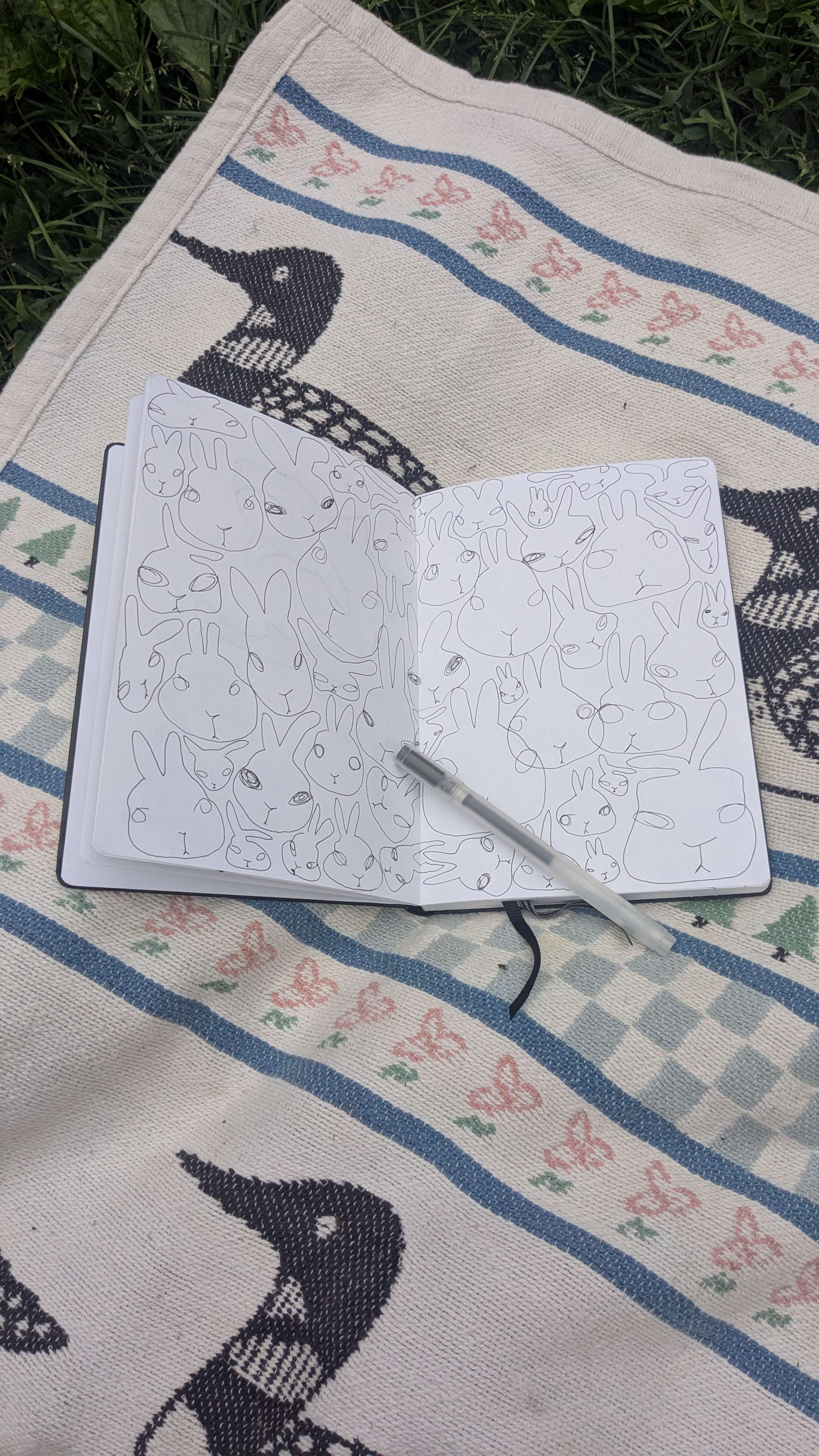 sketchbook page full of rabbits