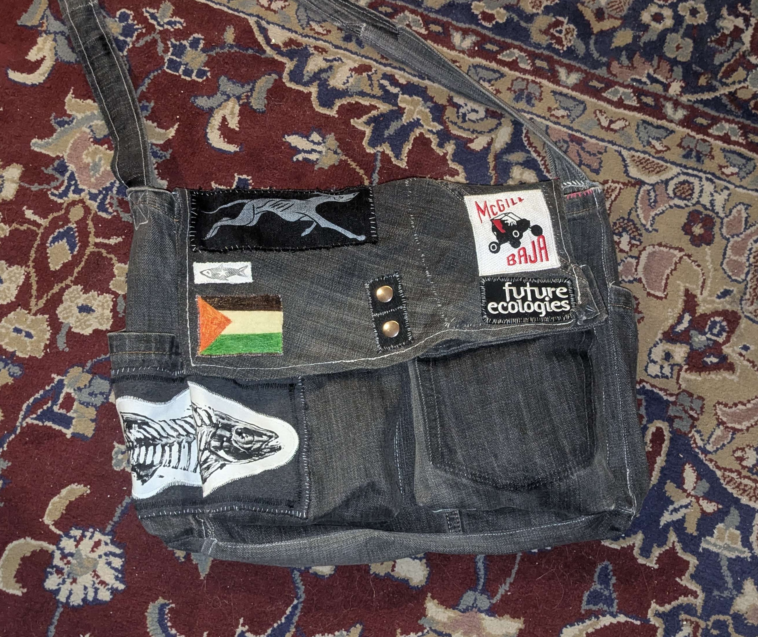 black crossbody bag made of old jeans with decorative patches
