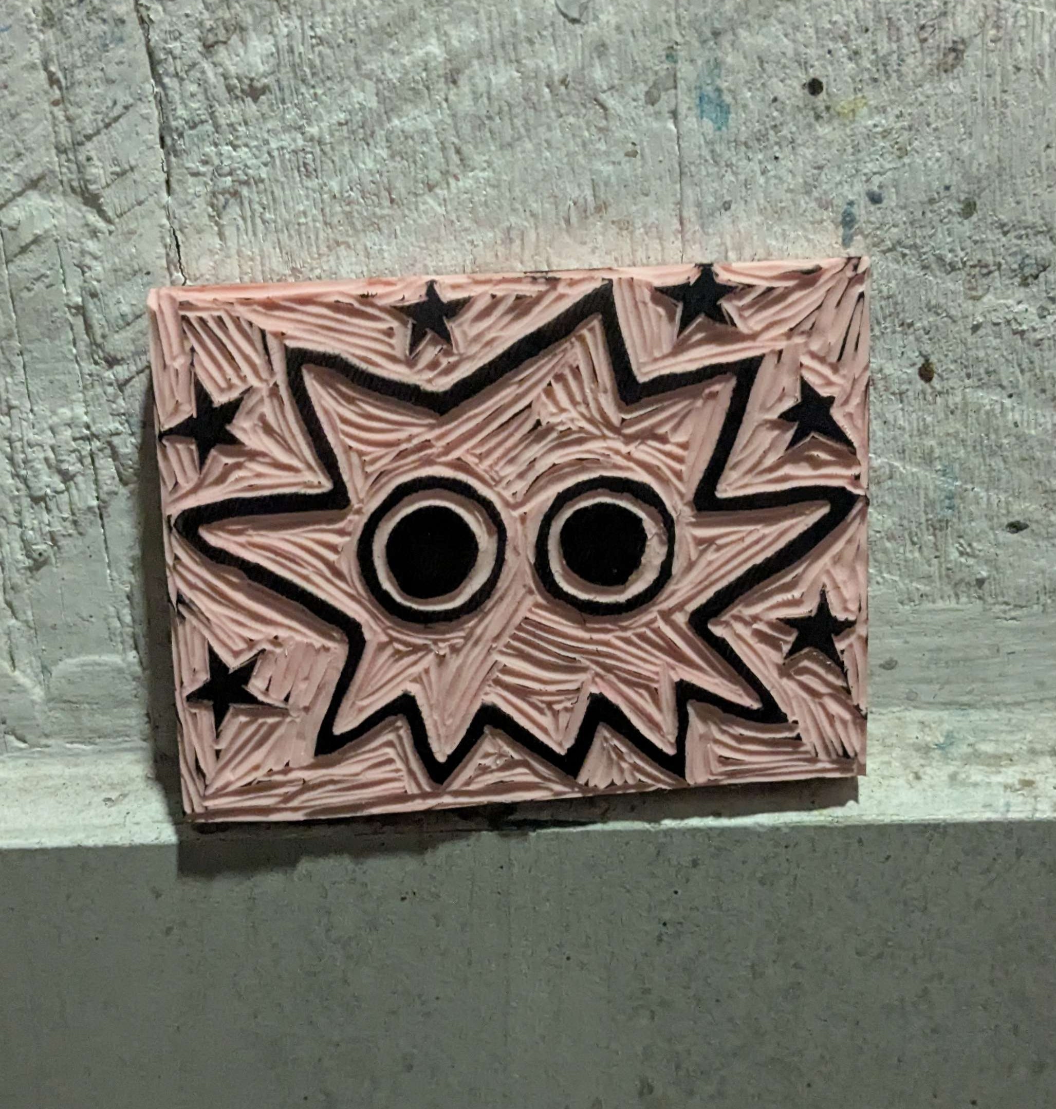 linocut stamp of a spikey blob