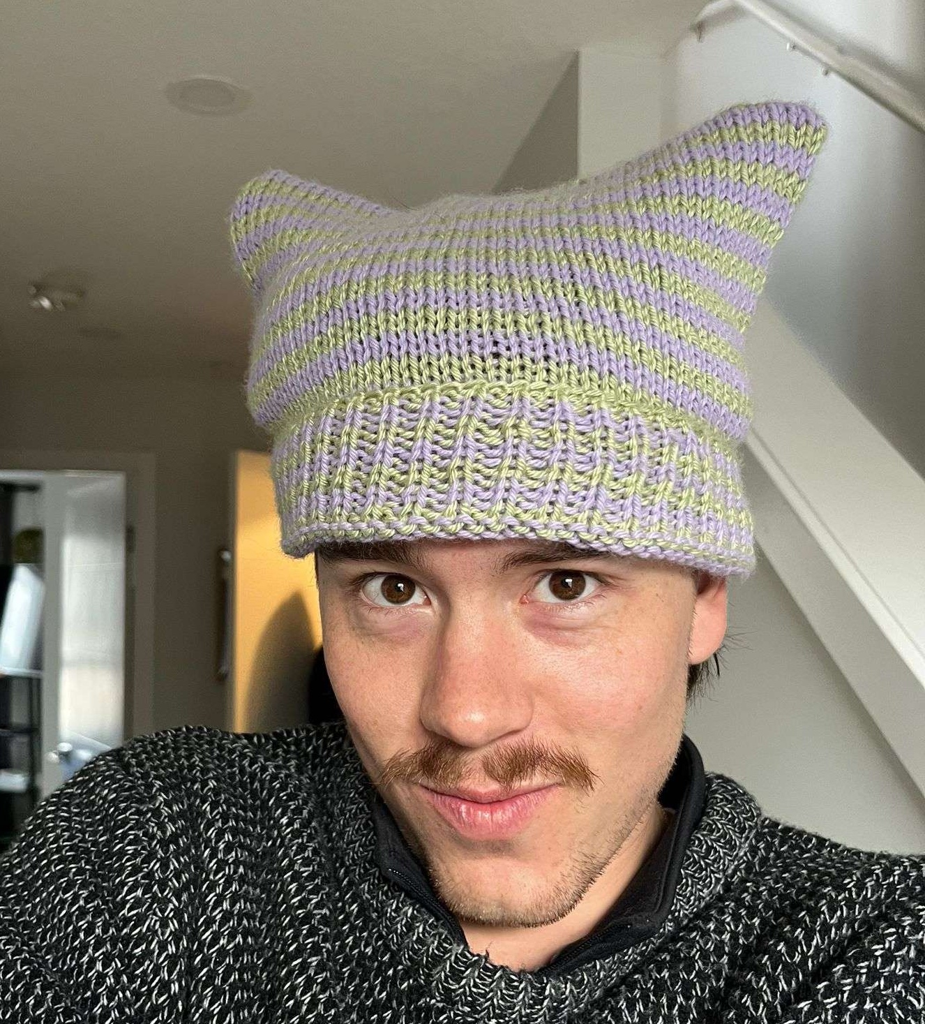 purple and green striped hat