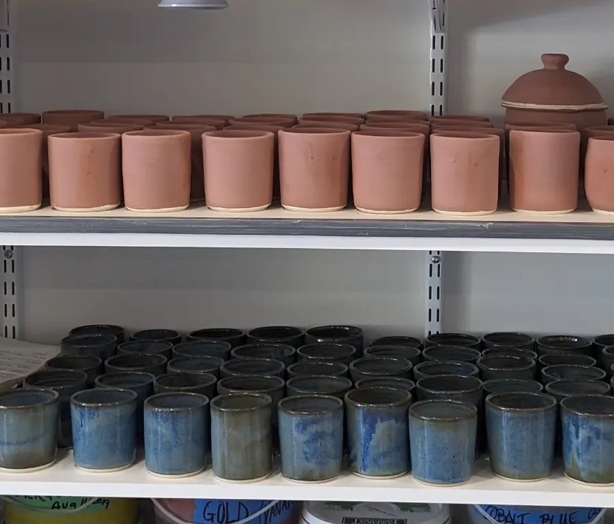 100 blue candle cups, half unfired, half complete