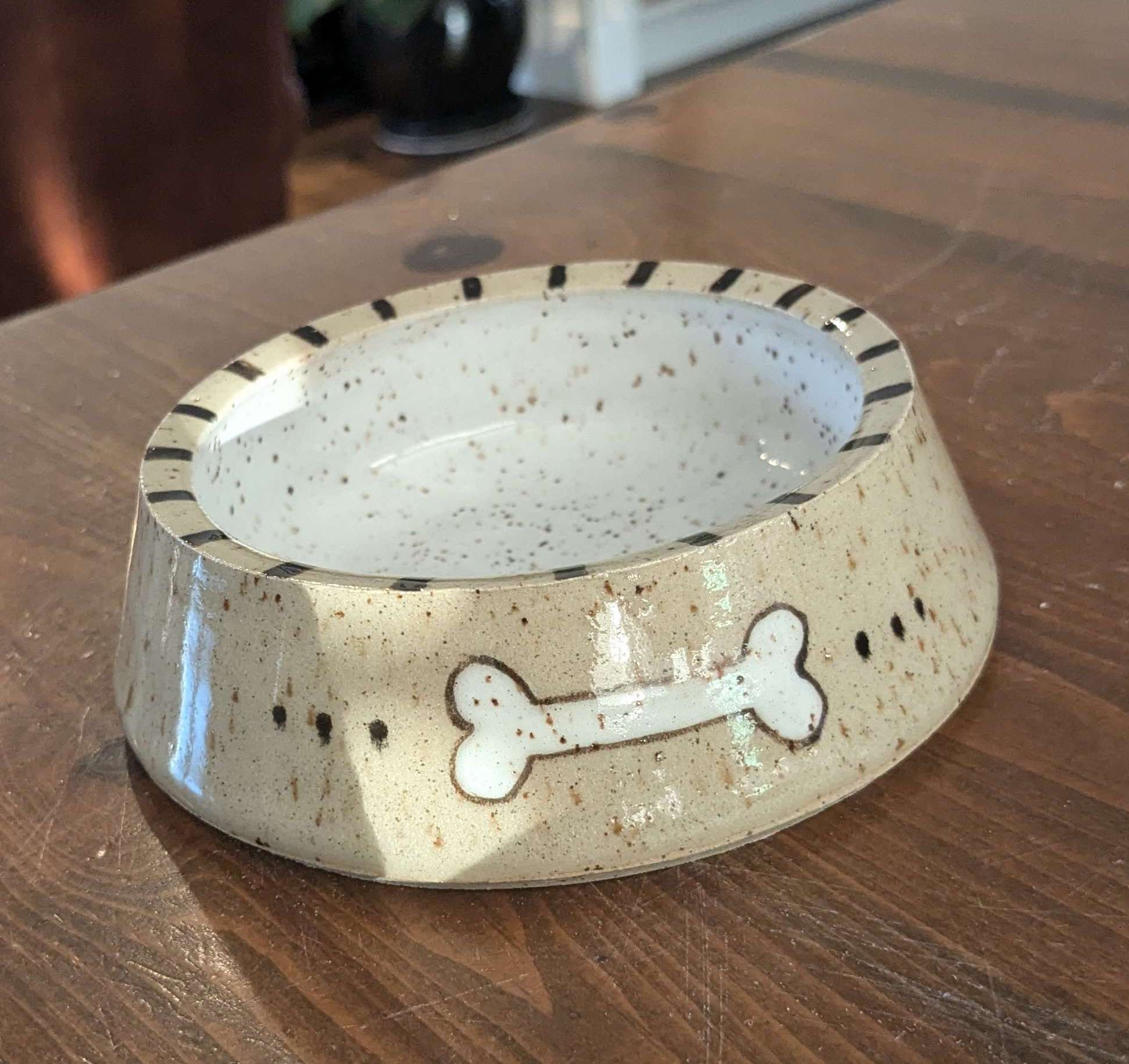 dog bowl with a bone on it