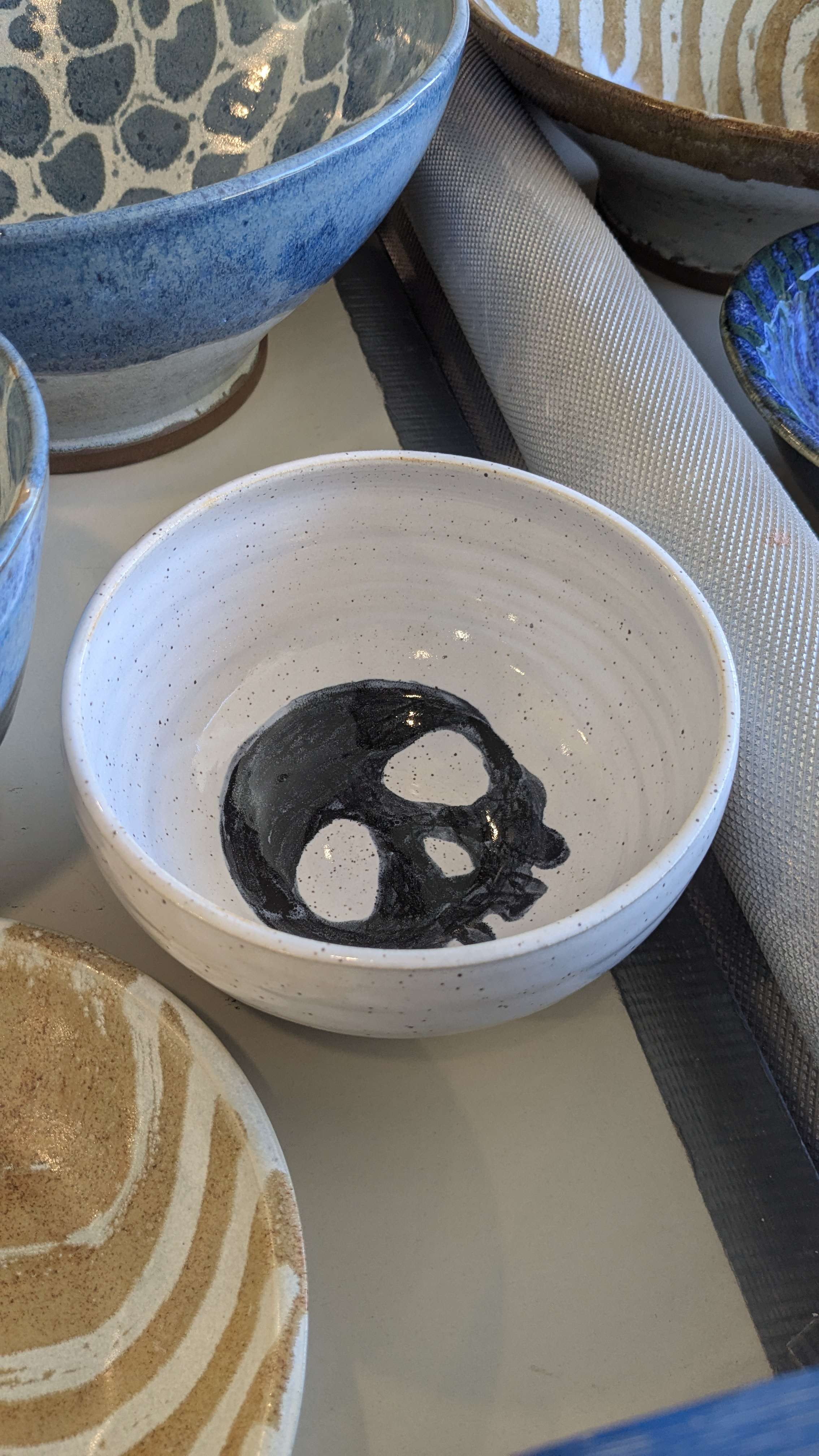 White bowl with a black skull